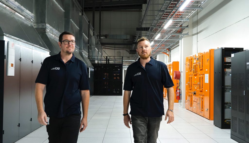 DCI team members walk through one of our data centres